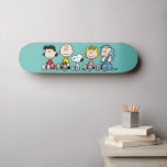 Erdnussbande zusammensitzen skateboard<br><div class="desc">Karo aus Lucy,  Charlie Brown,  Snoopy,  Sally und Linus,  die hintereinander sitzen.</div>