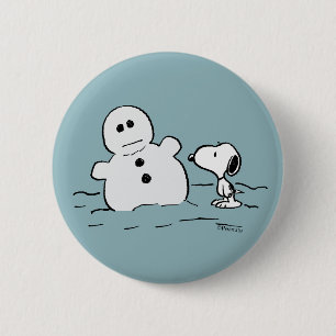 Erdnüsse Snoopy baut einen Schneemann Button