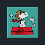 Erdnüsse | Snoopy the Flying Ace Button<br><div class="desc">Dieses niedliche Peanuts-Design zeigt Snoopy als Ass-Lektüre des Ersten Weltkriegs,  um den Roten Baron von Deutschland zu übernehmen.</div>