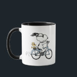 Erdnüsse | Snoopy & Woodstock Fahrrad Tasse<br><div class="desc">Beginnen Sie Ihren Tag mit einem Lächeln auf dieser Peanuts Tasse mit Snoopy und Woodstock, die gemeinsam ein Fahrrad fahren. Dieses spielerische Design, das perfekt für Kaffee, Tee oder Ihr Lieblingsgetränk geeignet ist, erweckt den Charme und den Spaß der geliebten Peanuts-Figuren. Ein wunderschönes Geschenk für Fans von Snoopy, Woodstock und...</div>