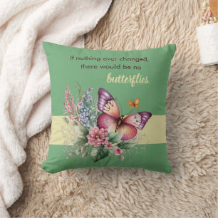 Ermutigungsschmetterling und Blumen auf Grün Kissen