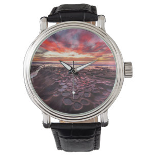 Erstaunlicher Sonnenuntergang an den Gezeitentümpe Armbanduhr