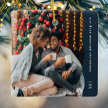 Erste verheiratete Weihnachten zwei Foto einfache  Keramikornament<br><div class="desc">Dieses schlichte, moderne Weihnachtsschmuck besticht durch eine trendige, wellenförmige blaue Kante, ein großes Foto und einen Raum für den individuellen Text und das Jahr. Dieses Ornament, das für ein frisch vermähltes Ornament konzipiert wurde, feiert gemeinsam ein erstes Weihnachtsfest und zeigt ein großes Foto auf der Vorderseite und ein zweites auf...</div>