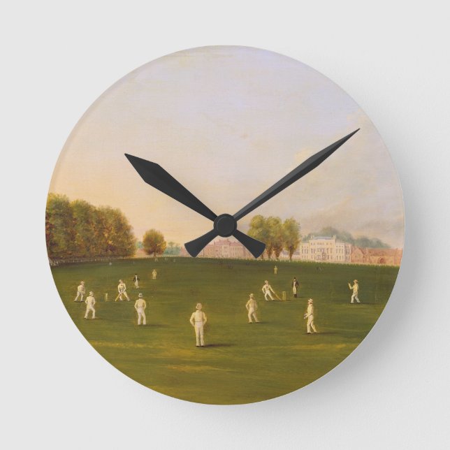 Erstes großartiges Match des Krickets spielte Runde Wanduhr (Vorderseite)