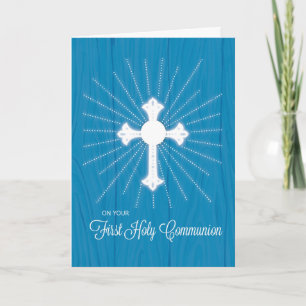 Erstkommunionkreuz und Strahlen auf blauem Holz Karte