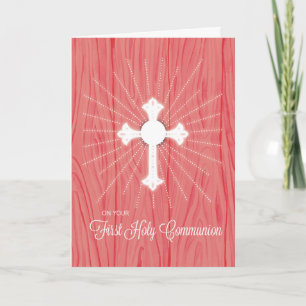 Erstkommunionkreuz und Strahlen auf rosa Holz Karte