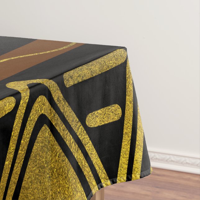 Ethnisches afrikanisches goldenes Muster auf Tischdecke (Beispiel)