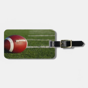 Étiquette À Bagage Étiquette de bagage du football avec le bracelet