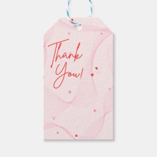 Étiquette cadeau avec lignes ondulées roses et cœu