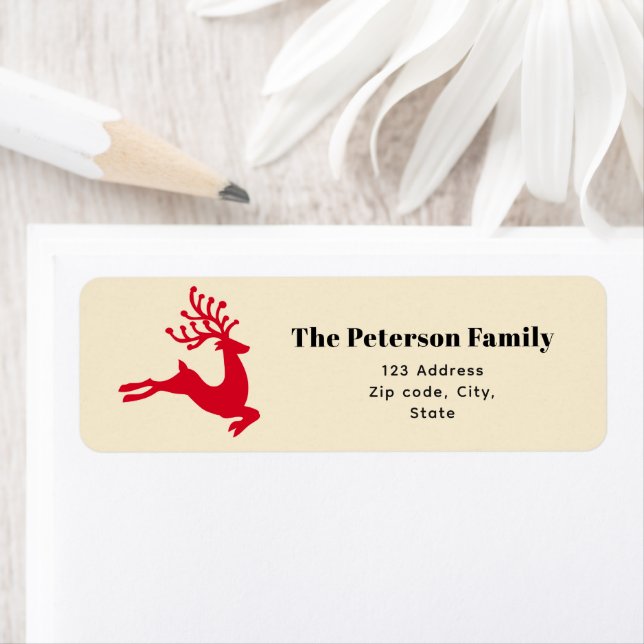 Étiquette Festive moderne renne rouge sauter sur la crème (En situation)