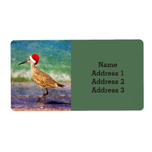 Étiquette Oiseau d'eau avec un chapeau de Père Noël sur la p