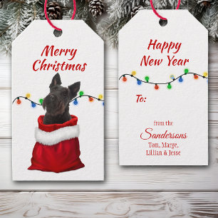 Étiquettes-cadeau Black Scottish Terrier dans le sac Père Noël