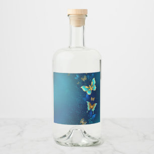 Étiquettes Pour Bouteilles De Liqueur Papillons d'or sur un Arrière - plan bleu