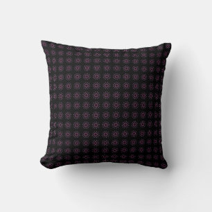 étoiles de rose sur le coussin noir
