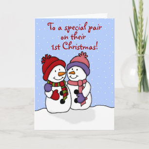 Étreindre la carte de Noël de jumeaux de bonhommes