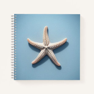 Exotischer Seestern mit blauem Hintergrund Notizbuch