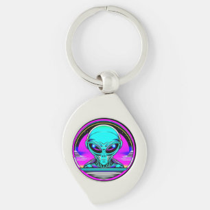 Extra-Terrestriale Alien mit einem UFO Schlüsselanhänger