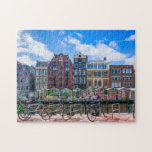 Fahrradhäuser am Canal de Amsterdam Niederlande<br><div class="desc">Dieses atemberaubende City-Puzzle bietet Fahrräder entlang des Amsterdamer Kanals mit Gebäude im Hintergrund. #amsterdam #jigsawpuzzle #gift #stockingstuffe</div>