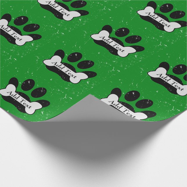 Falsche Dog-Paw-Druck und Knochen auf Grün Geschenkpapier (Ecke)