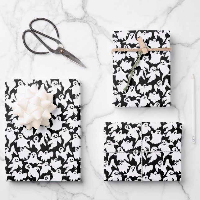 Fantômes d'Halloween enveloppant des feuilles de p (Recto)