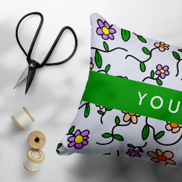 Farbenfrohe Blume, blauer Hintergrund, grün Dekokissen