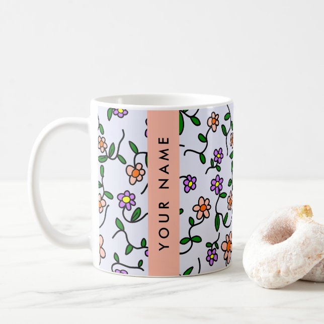 Farbenfrohe Blume, blauer Hintergrund, orange Kaffeetasse (Mit Donut)