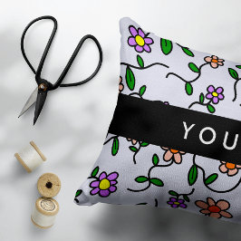 Farbenfrohe Blume, blauer Hintergrund, schwarz Dekokissen