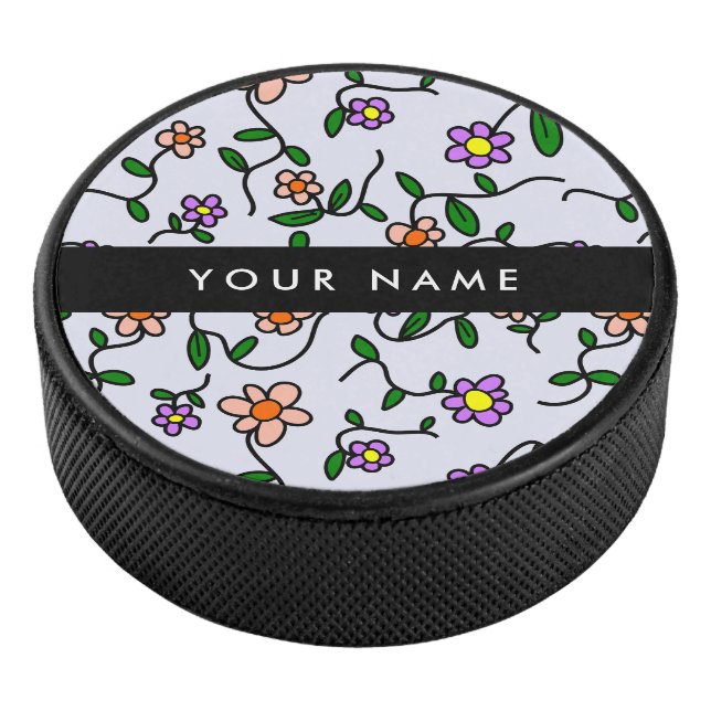 Farbenfrohe Blume, blauer Hintergrund, schwarz Eishockey Puck (3/4)