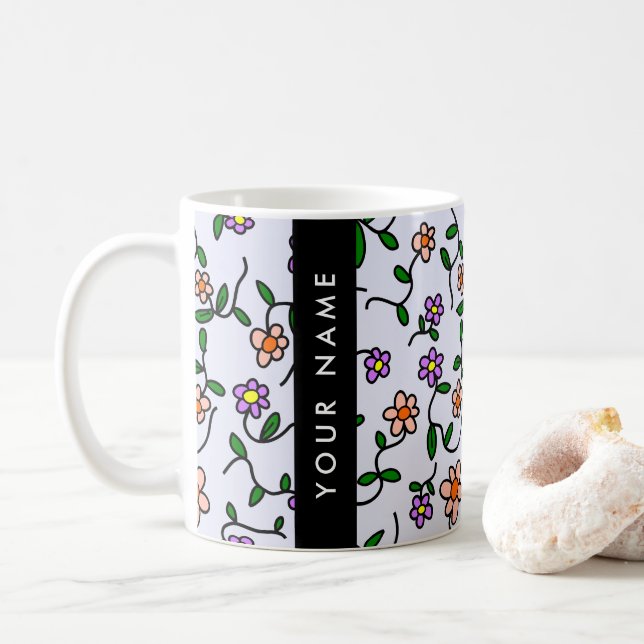 Farbenfrohe Blume, blauer Hintergrund, schwarz Kaffeetasse (Mit Donut)