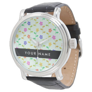 Farbenfrohe Blume, hellgrüner Hintergrund, schwarz Armbanduhr