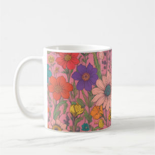 Farbenfrohe Blumenmuster auf rosa Kaffeetasse