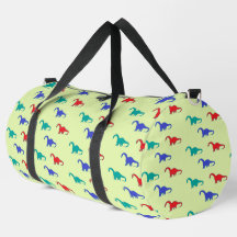 Farbenfrohe Dinosaurier-Muster auf grün