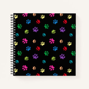 Farbenfrohe gestrichene Paw-Prints auf schwarz Notizbuch