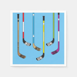 Farbenfrohe Hockeyschläger und Puck auf blau Serviette