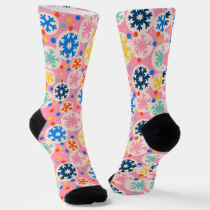 Farbenfrohe Schneeflocken im rosa Urlaubsmuster Socken