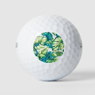 Farbenfrohe tropische Blätter von Banana und Monst Golfball