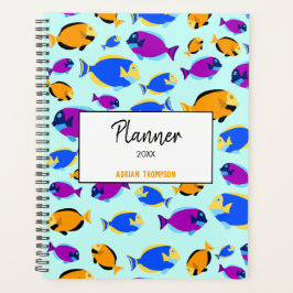 Farbenfrohe tropische Fischmuster im Blauen Meer Planer