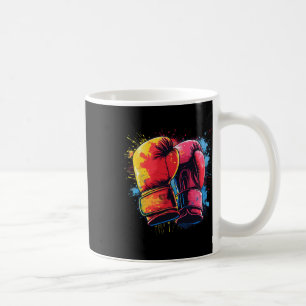 Farbige bemalte Boxhandschuhe beim künstlerischen Kaffeetasse