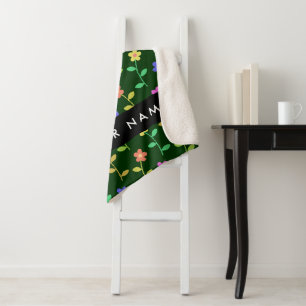 Farbige Blume, grüner Hintergrund, schwarz Sherpadecke