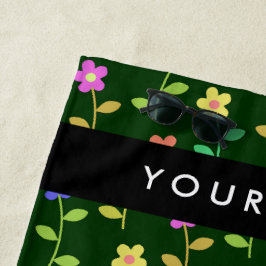 Farbige Blume, grüner Hintergrund, schwarz Strandtuch