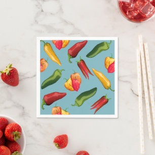 Farbige Chili-Paprikaschoten auf blau Serviette