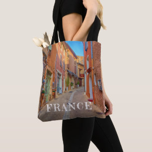 Farbige französische Hügellandschaftsstadt Tasche