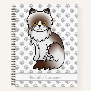 Farbige Persische Niedliche Katze mit Schokolade u Notizbuch
