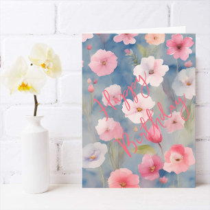 Farbige rosa Frühlingsblumen auf Blautönen Karte