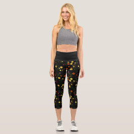 Farbige, verstreute Blumenmuster auf schwarzer Bas Capri Leggings