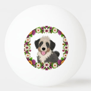 Farbiger Blumenrahmen mit süßer Hundeillustration Tischtennisball