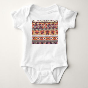 Farbiger Stammesstil, lebendiges nahtloses Muster. Baby Strampler