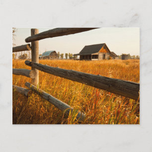 Farmhouse und Eisenbahnzaun in Grand Teton Postkarte