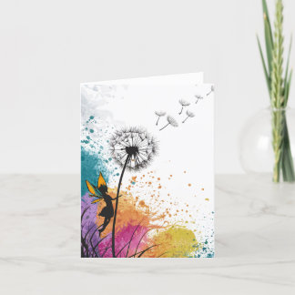 Fée secouant une carte blanche de pandelion