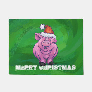 Feierliches Schwein in Weihnachtsmannmütze auf Grü Fußmatte